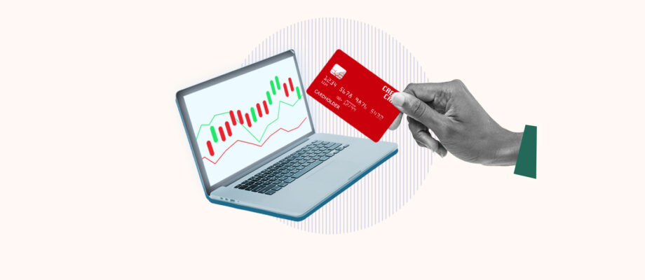 Computer showing stock being bought with a credit card